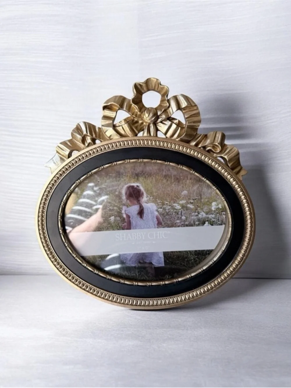 Ornate Oval Gold Photo Frame with Black Trim bow on top 7”x5”
